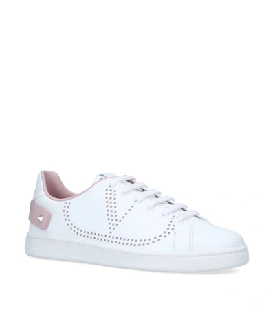 Shop Valentino Garavani Leather Backnet Sneakers