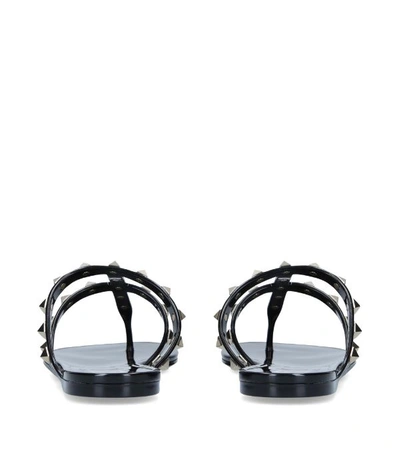 Shop Valentino Rubber Rockstud Sandals In Black