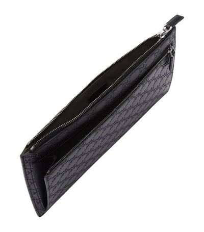 Shop Gucci Gg Embossed Pouch
