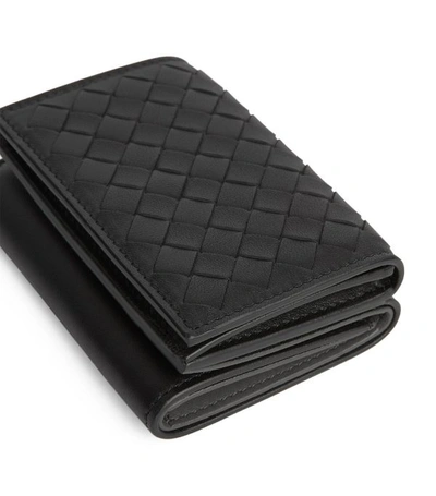 Shop Bottega Veneta Leather Intrecciato Foldover Wallet
