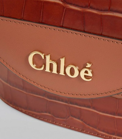Shop Chloé Small Leather Embossed Aby Lock Bag