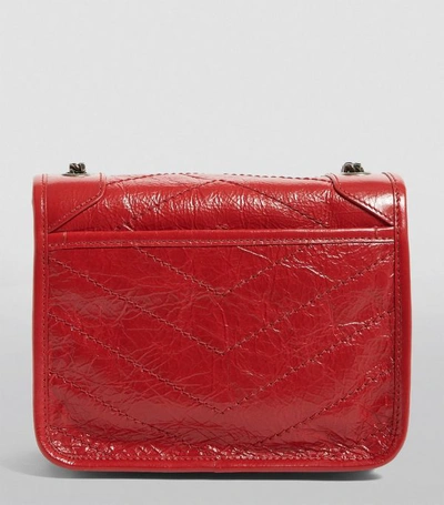 Shop Saint Laurent Small Leather Niki Chain Wallet