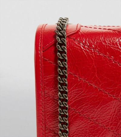 Shop Saint Laurent Small Leather Niki Chain Wallet