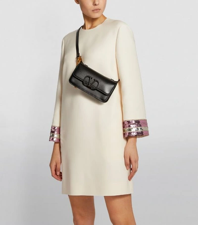 Shop Valentino Garavani Leather Vsling Belt Bag