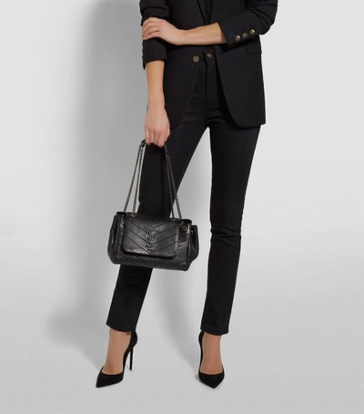 Shop Saint Laurent Medium Nolita Shoulder Bag In Black