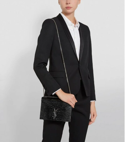 Shop Saint Laurent Cassandra Croc-embossed Shoulder Bag