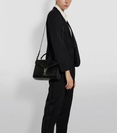 Shop Saint Laurent Medium Cassandra Croc-embossed Top-handle Bag