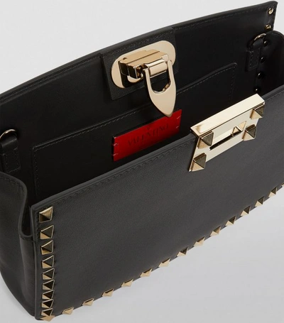 Shop Valentino Garavani Leather Rockstud Clutch Bag