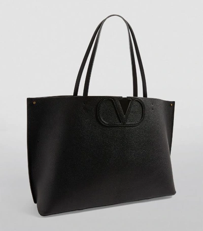 Shop Valentino Garavani Leather Vlogo Tote Bag