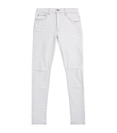 Shop Amiri Skinny Knee-slash Jeans