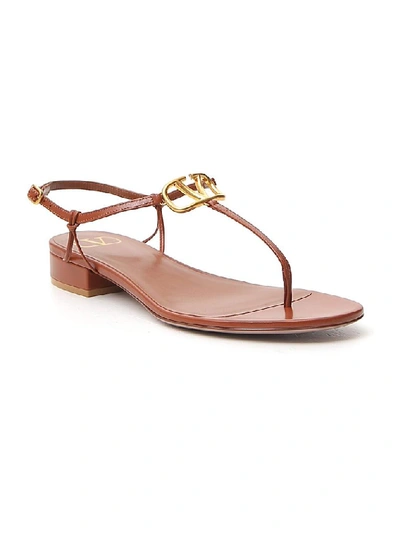 Shop Valentino Vlogo Thong Sandals In Brown