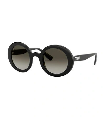 Shop Miu Miu Round Sunglasses