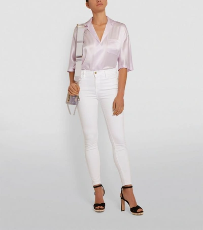 Shop Frame Le High Skinny Jeans In White