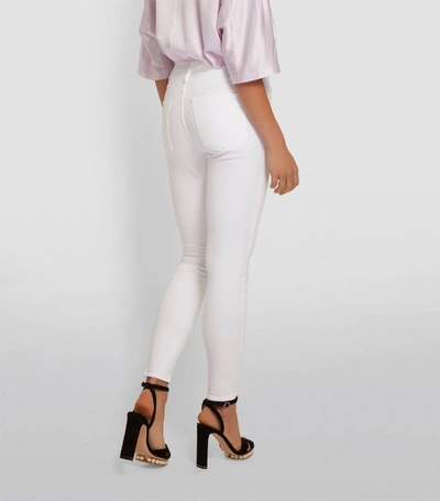 Shop Frame Le High Skinny Jeans In White