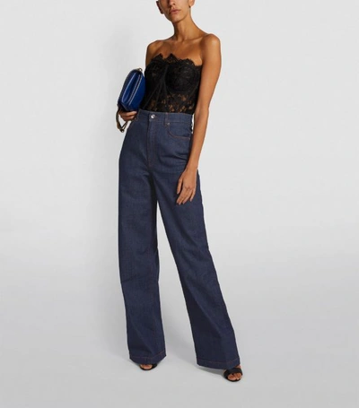 Shop Dolce & Gabbana Flared Wide-leg Jeans
