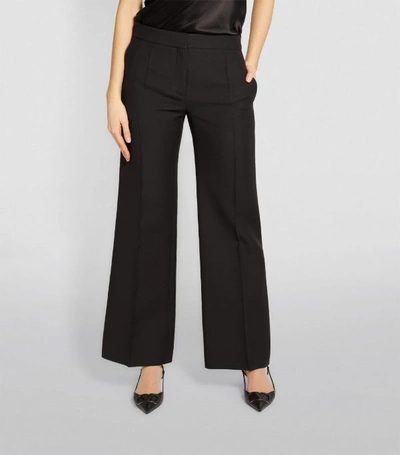 Shop Valentino Pleated Wide-leg Trousers