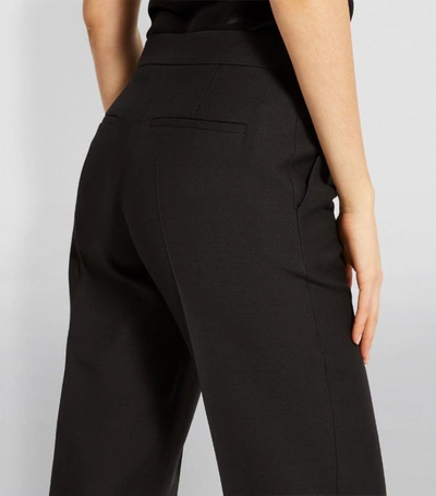 Shop Valentino Pleated Wide-leg Trousers