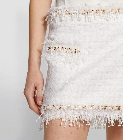 Shop Balmain Chain-embellished Fringed Tweed Skirt