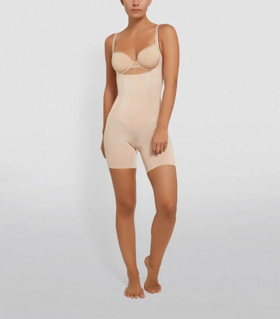 Shop Spanx Oncore Open Bust Mid-thigh Bodysuit In Multi