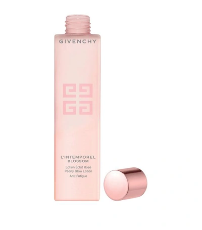 Shop Givenchy L'intemporel Blossom Pearly Glow Lotion (200ml) In White
