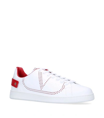 Shop Valentino Garavani Perforated Logo Sneakers