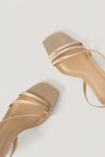 Shop Na-kd Asymmetric Strap Heels - Gold In Gold Metallic