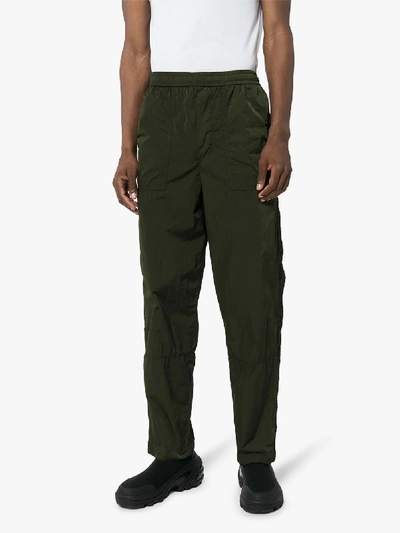 Shop Moncler Logo Tape Side Shell Sweatpants In Green