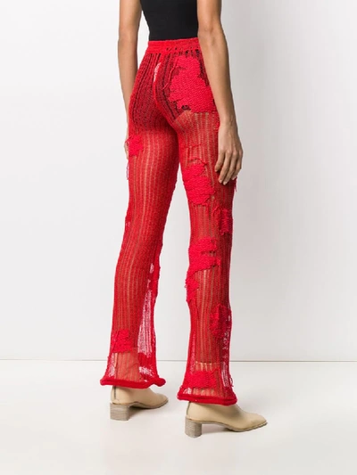 Shop Acne Studios Floral-embroidered Knitted Trousers In Red