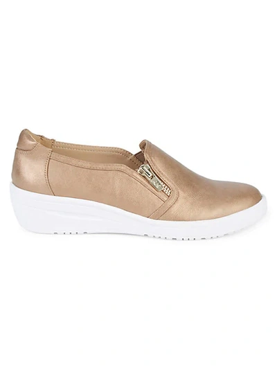 Shop Anne Klein Yuriko Metallic Slip-on Wedge Sneakers In Bronze