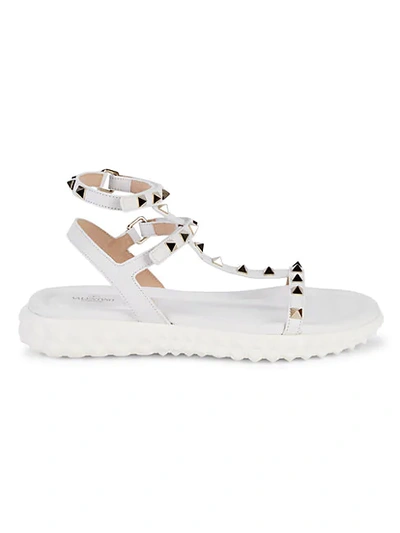 Shop Valentino Studded Leather Sandals In White