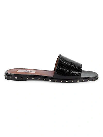 Shop Valentino Rockstud Snakeskin-embossed Leather Slides In Nero