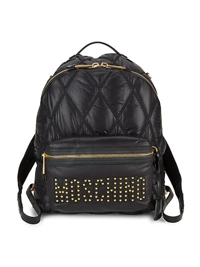 Shop Moschino Studded Logo Quilted Backpack In Black