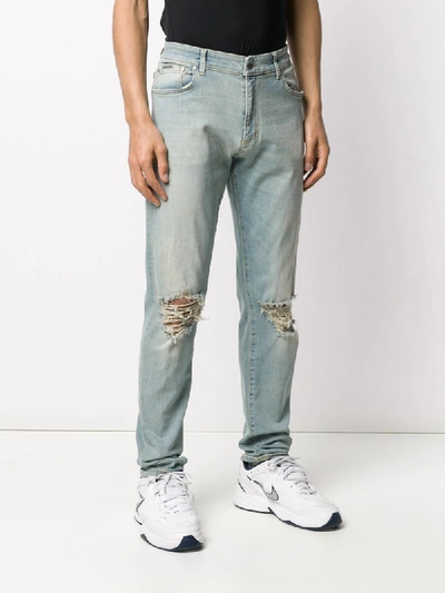 Shop Represent Slim Faded Jeans In Blue