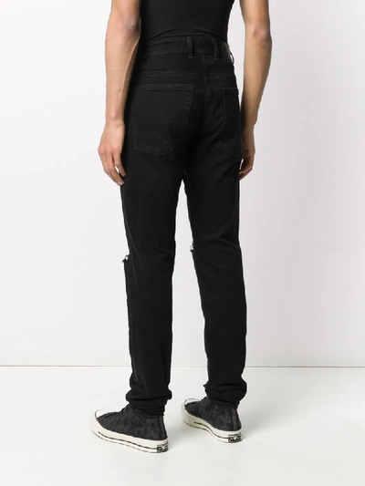 Shop Represent Distressed Skinny Jeans In Black