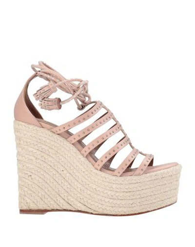 Shop Alaïa Sandals In Pale Pink