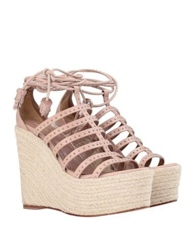 Shop Alaïa Sandals In Pale Pink