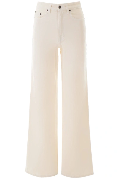 Shop The Row Flared Jeans In Vanilla (beige)