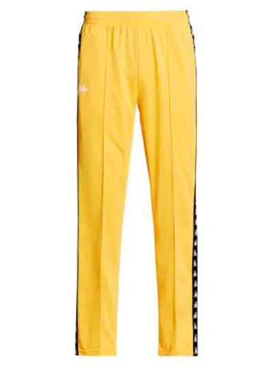 Shop Kappa 222 Banda Logo Tape Track Pants In Yellow Black