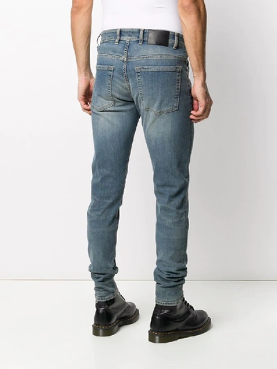 Shop Represent Faded Slim Jeans In Blue