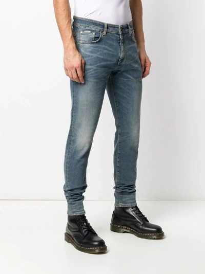 Shop Represent Faded Slim Jeans In Blue
