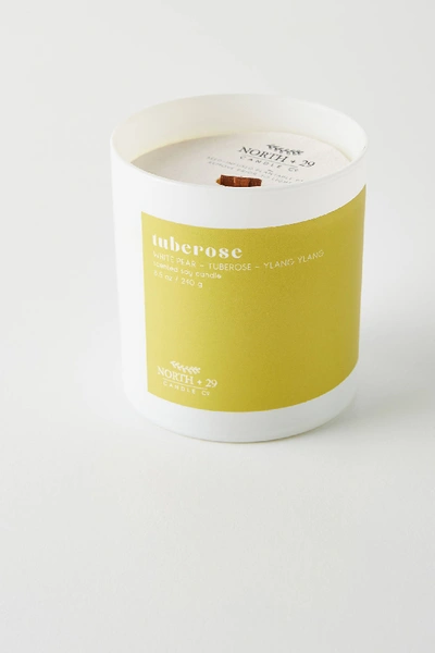 Shop Anthropologie Nurture Tumbler Candle In Yellow