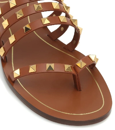 Shop Valentino Rockstud Leather Sandals In Brown