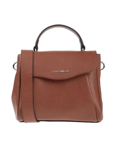 Shop Coccinelle Handbag In Brown