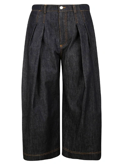 Shop Jw Anderson Pleated Cropped Denim Trousers In Indigo