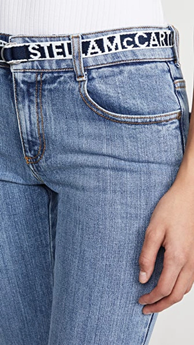 Shop Stella Mccartney Mid Rise Logo Belt Jeans In Salt & Pepper