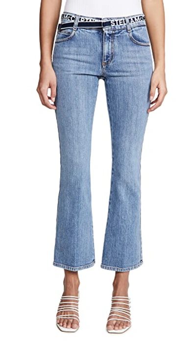 Shop Stella Mccartney Mid Rise Logo Belt Jeans In Salt & Pepper