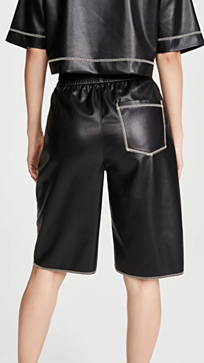 Shop Nanushka Yolie Faux Leather Shorts In Black