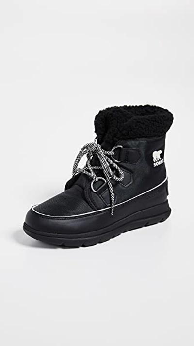 Shop Sorel Explorer Carnival Boots In Black/sea Salt