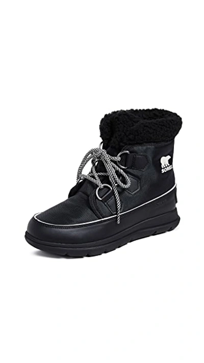 Shop Sorel Explorer Carnival Boots In Black/sea Salt