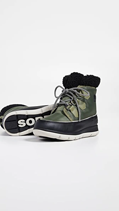 Shop Sorel Explorer Carnival Boots In Hiker Green/black